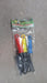A clear plastic package contains a red, yellow, and blue handled garden tool set, lying on a concrete surface.