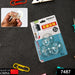 Retail packaging for three transparent suction cup hooks on a dark textured surface with office supplies.