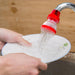 Compact plastic 360-Degree Shower Head attached to a tap, showing its flexible design.