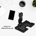 PHOBIA black mobile charging wall holder securely installed on a power socket.