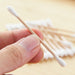 Sustainable cotton swabs made with natural bamboo sticks.