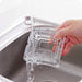 A square crystal ashtray, reflecting light beautifully on a tabletop.