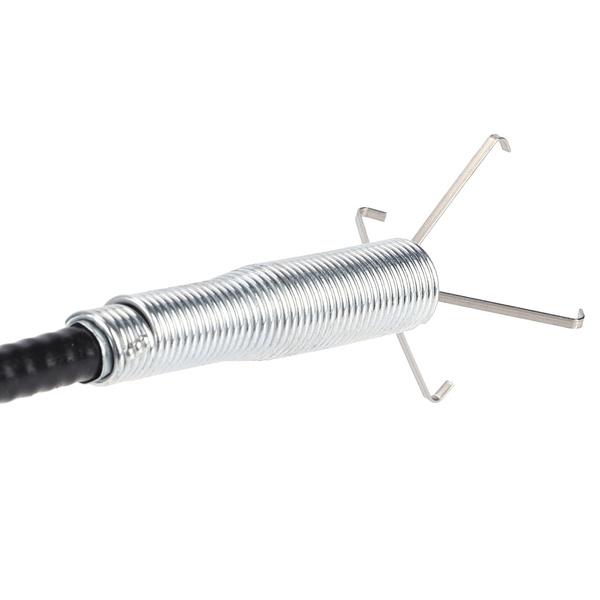 Detailed view of the silver coiled spring and four metal claws at the end of the black flexible drain cleaner.