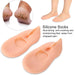 Two peach silicone heel socks with text describing them as nourishing, anti-cracking, and moisturizing.