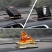 Three separate views of the anti-skid mat in use, holding a radar detector, car key, and a decorative dragon statue.