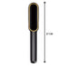 Hair straightener displaying temperature control buttons and LED readout.