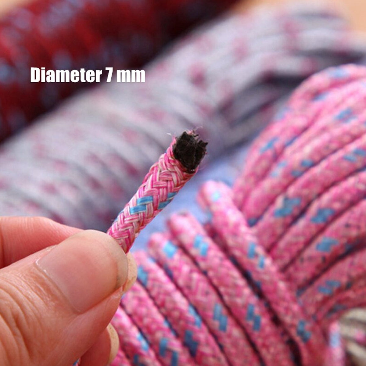 A hand holding the end of a pink and blue braided rope, showing its 7mm diameter.