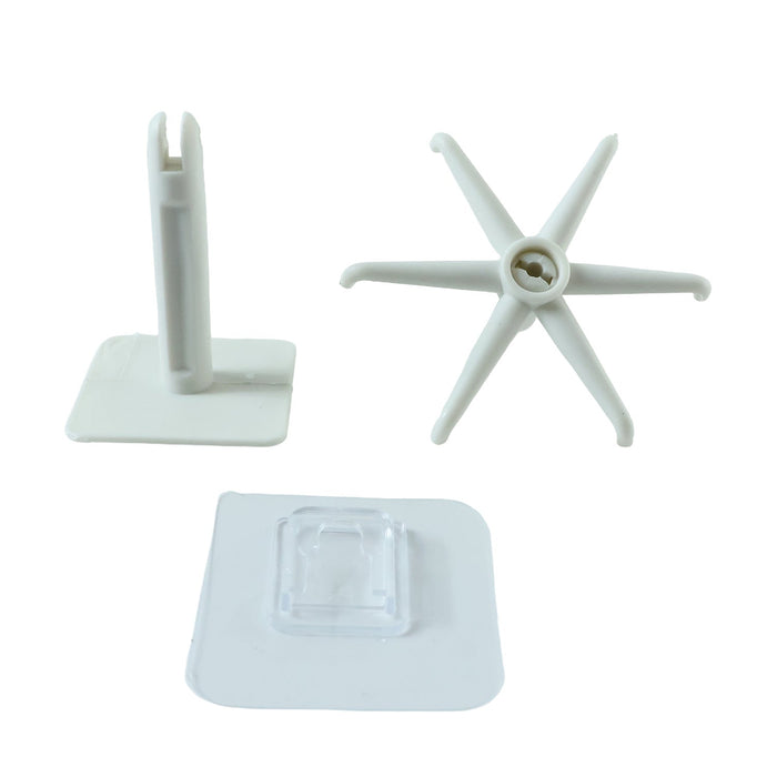 Three white plastic components of a rotating hook are arranged on a white background.