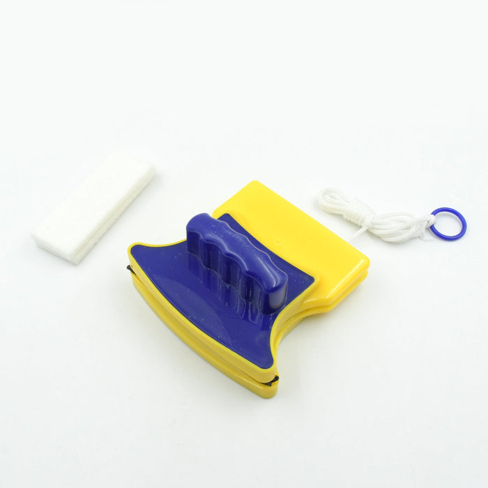 Blue and yellow magnetic window cleaner with a white cleaning pad and safety rope on a white surface.