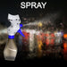 A gray and blue spray bottle with a fine mist spraying from the nozzle against a dark, blurred background.