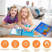 Two smiling children lie on a rug, coloring in water books with pens, while adults sit on a sofa in the background.