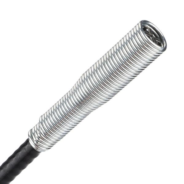 Close-up of the silver coiled spring section of the drain cleaner, extending from the black flexible shaft.