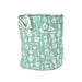 Mint green fabric laundry hamper with white kitchen utensil pattern on a plain white background.