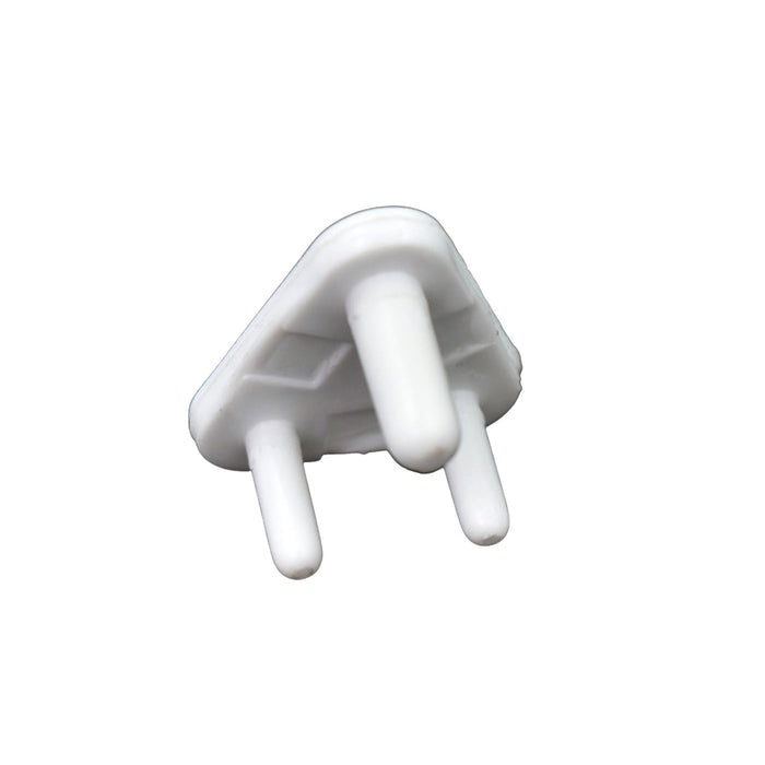A single white plastic child safety socket cover, triangular with three prongs, viewed from an angle on a white background.