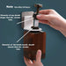 A hand holds a brown bottle being inserted into a wall-mounted holder, with text indicating measurement guidelines.
