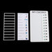 A white plastic frame, a sheet of chore icons, and the 'MY CHORES' board with green checkmarks, all on a black background.