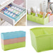 Clear plastic divider box displaying its robust construction and separate sections.