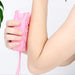 Soft silicone body scrubber in a bubble bath, showing its gentle bristles.