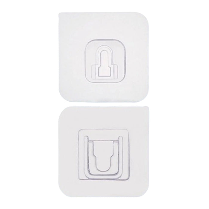 Adhesive wall hooks holding various kitchen utensils, showcasing their versatile use.