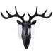 White deer head self-adhesive wall hook attached to a door, ready for use.