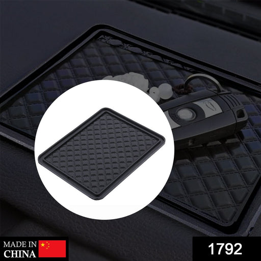 A black anti-skid mat with a diamond pattern is shown on a car dashboard with car keys. Inset shows the mat alone