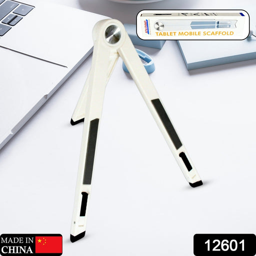 A white foldable stand with black grip pads is open on a white surface, with a product label in the corner.