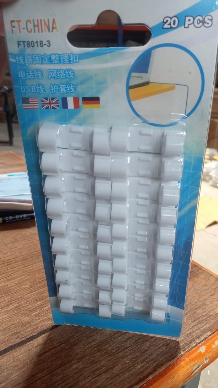 A close-up view of the round sticky cable clips, highlighting their strong adhesive backing.