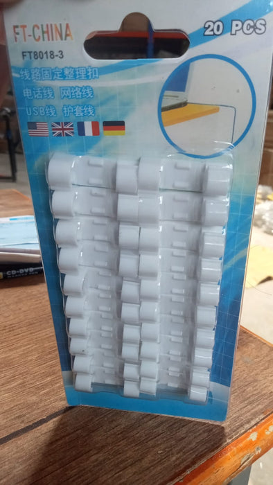 A close-up view of the round sticky cable clips, highlighting their strong adhesive backing.