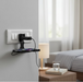 Detailed view of the foldable mechanism on the PHOBIA black mobile charging wall holder.
