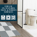 A bathroom scene with a toilet and shower, featuring text about the mat's suitability for various surfaces.