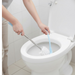 The toilet brush with holder in a clean, minimalist bathroom setting.