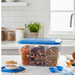 Airtight 3-section food storage box with a clear lid, showcasing organized ingredients.