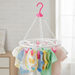 Close-up of the durable plastic clips on the multicolour drying stand.