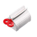 A white plastic tube squeezer with a red winding key is shown on a white background.