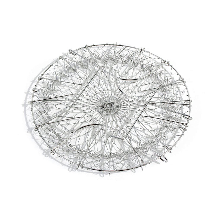 The durable stainless steel chef basket straining boiled vegetables for a healthy meal.