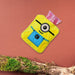 Minions hot water bag with its soft yellow fabric cover, perfect for pain relief.