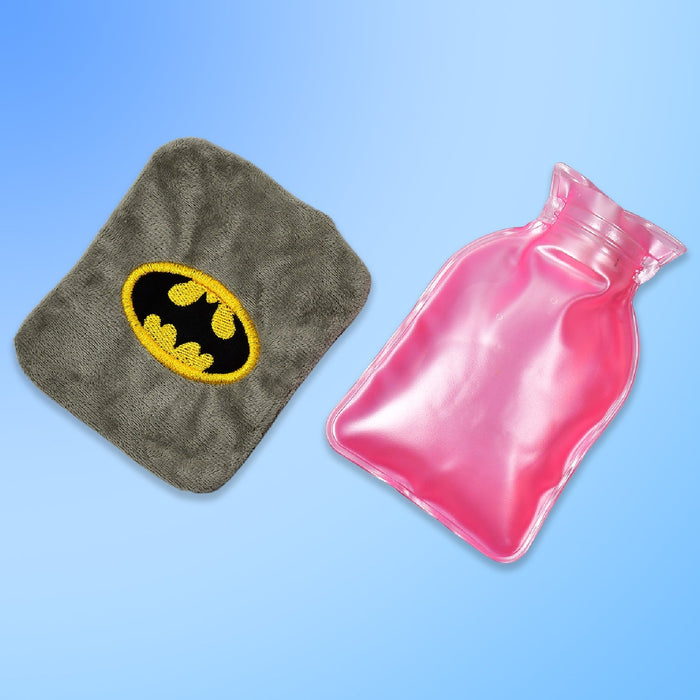 Gray plush cover with Batman logo next to a pink transparent hot water bottle on a blue background.