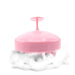 Hand holding the easy-grip scalp massager shampoo brush for comfortable use.