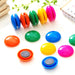 Close-up of vibrant round magnetic buttons for educational play.