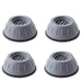 Four washer dryer vibration pads placed on floor surface
