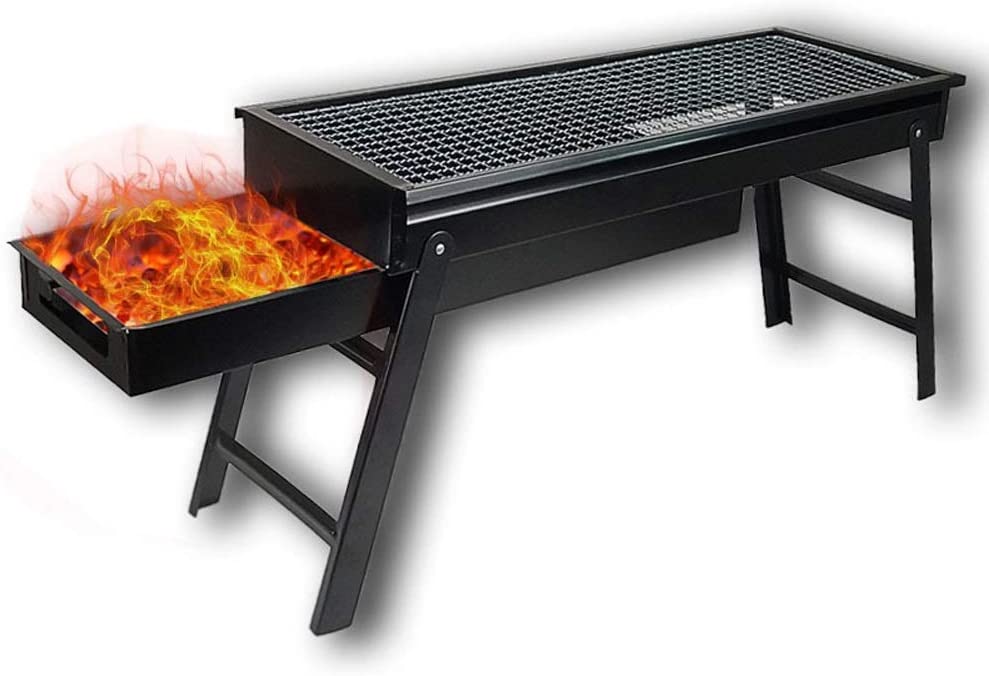 Black portable charcoal grill with a tray of burning coals and flames extending from the side.