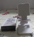 Convenient mobile stand holding a smartphone, shown in a home setting.