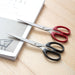 Top-down view of all-purpose stainless steel scissors with durable plastic handle.