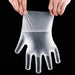 Retail packaging of 100-piece disposable clear gloves, ready for sale.