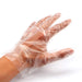 Person wearing disposable clear gloves while performing a task, ensuring hygiene.