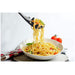 Detailed view of a non-stick slotted spoon from the utensil set.