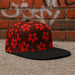 Close-up detail of a classic Hip Hop Snapback Hat, showcasing its durable fabric and quality stitching.