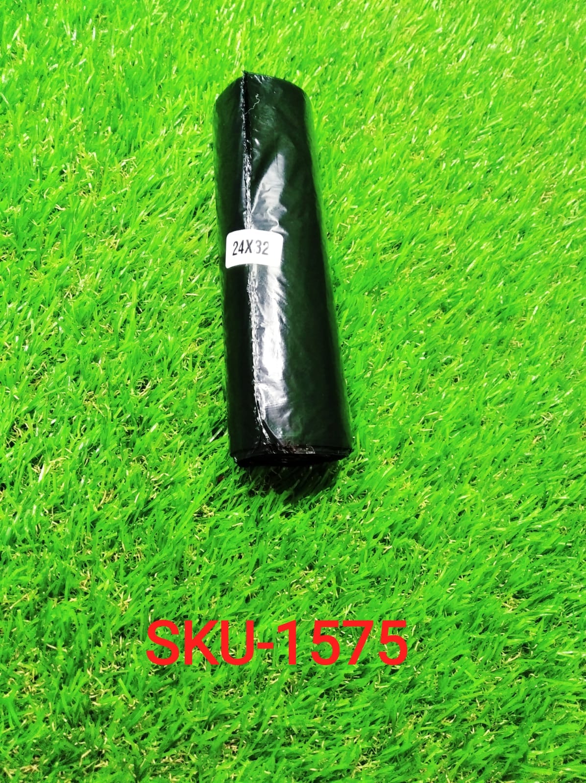 Close-up of the robust material of a FERVENT black rolled garbage bag.