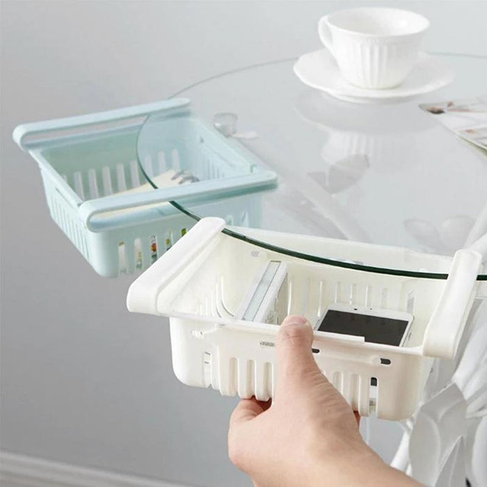 Empty adjustable fridge storage basket showcasing its clear, durable design.
