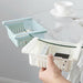 Empty adjustable fridge storage basket showcasing its clear, durable design.
